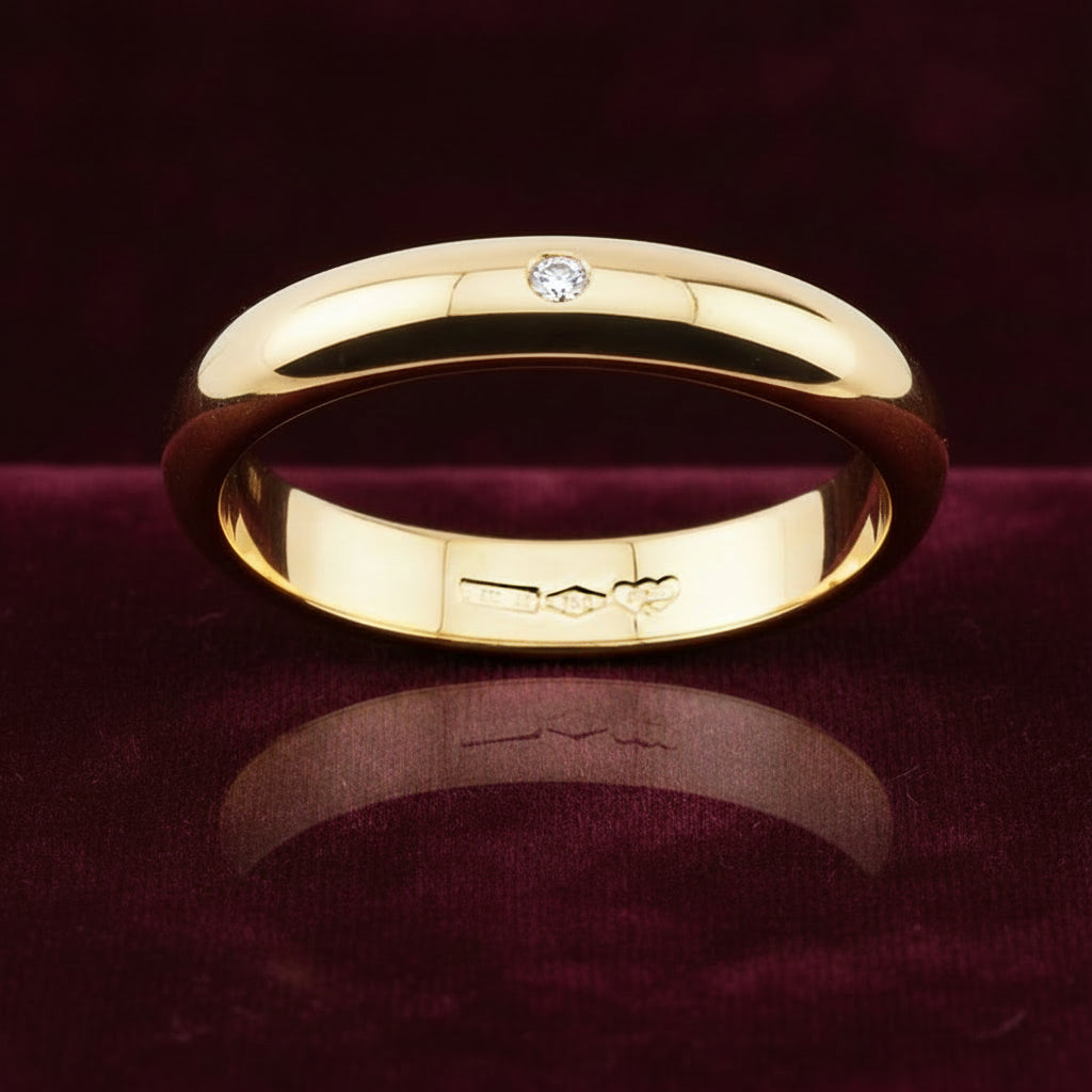 Fede nuziale ArtMID in oro giallo 18kt con diamante naturale 0.05 carati peso 5 grammi.