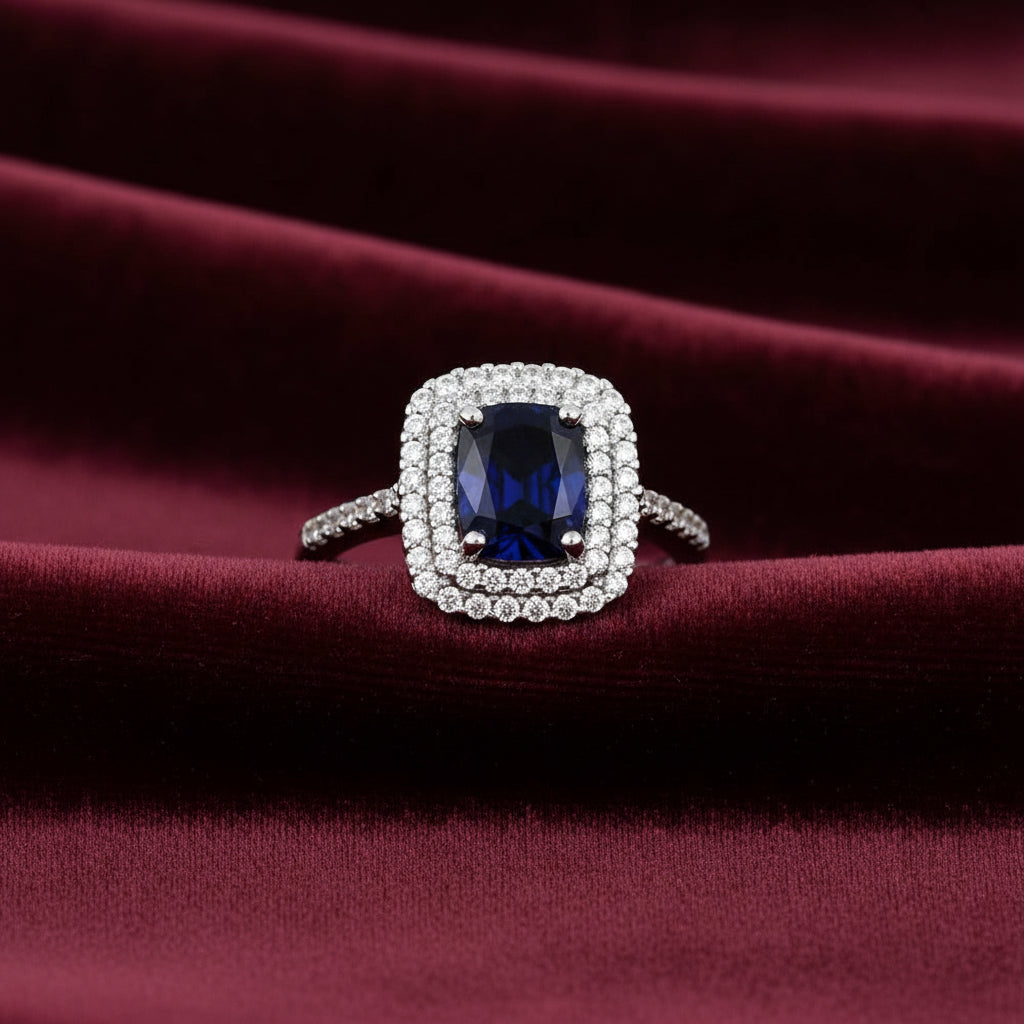 Anello modello Kate in oro bianco 18kt con pietra blu ovale e zirconi Art MID Gioielli