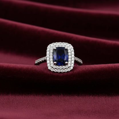Anello modello Kate in oro bianco 18kt con pietra blu ovale e zirconi Art MID Gioielli