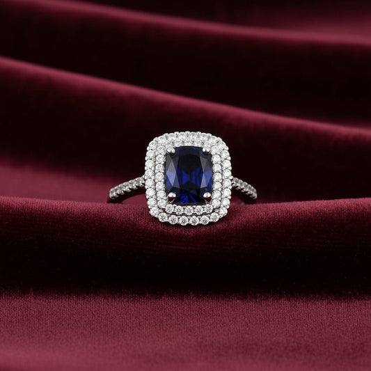 Anello modello Kate in oro bianco 18kt con pietra blu ovale e zirconi Art MID Gioielli