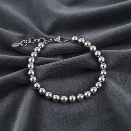 Bracciale con sfere grandi da 10mm in argento 925 su velluto grigio antracite con effetto onda.
