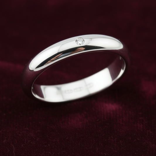 Fede nuziale ArtMID in oro bianco 18kt con diamante naturale 0.05 carati peso 5 grammi.