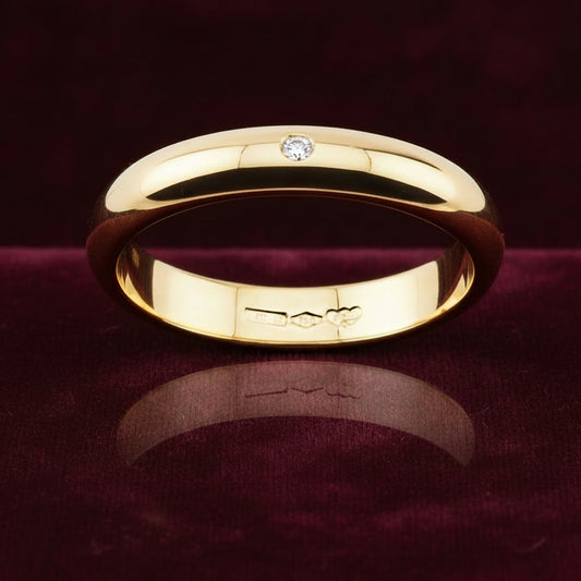 Fede nuziale ArtMID in oro giallo 18kt con diamante naturale 0.05 carati peso 5 grammi.
