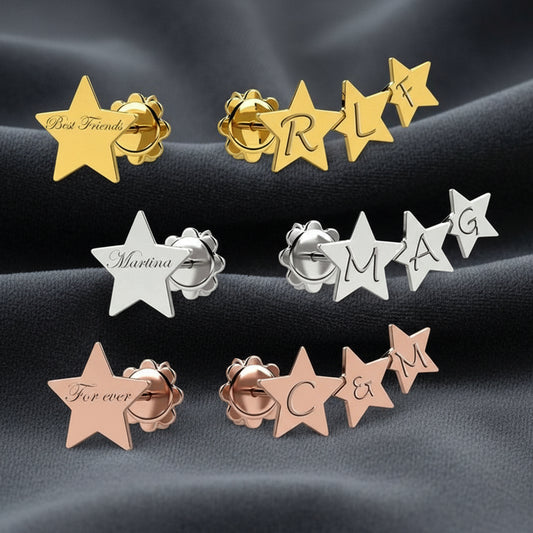 Orecchini a cerchio Art MiD con pendente a stella e nome personalizzato in argento 925 su velluto grigio antracite a onde.