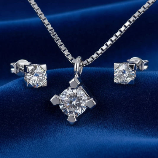 Set completo Art MiD: collana punto luce e orecchini in oro bianco 18kt con diamanti 0.49 ct su velluto blu a onde.